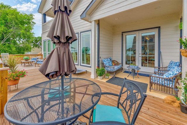 646 Echo Ln, Livingston, TX 77351 - deck with outdoor dining space and french doors