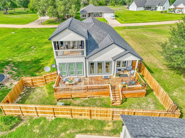 back of property with a deck and an outdoor hangout area