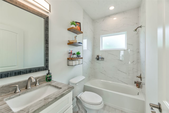 full bathroom with vanity, toilet, and tiled shower / bath combo