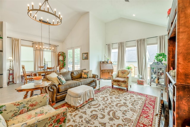 living room with french doors, a notable chandelier, hardwood / wood-style floors, and high vaulted ceiling