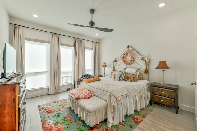 bedroom featuring ceiling fan and light hardwood / wood-style flooring