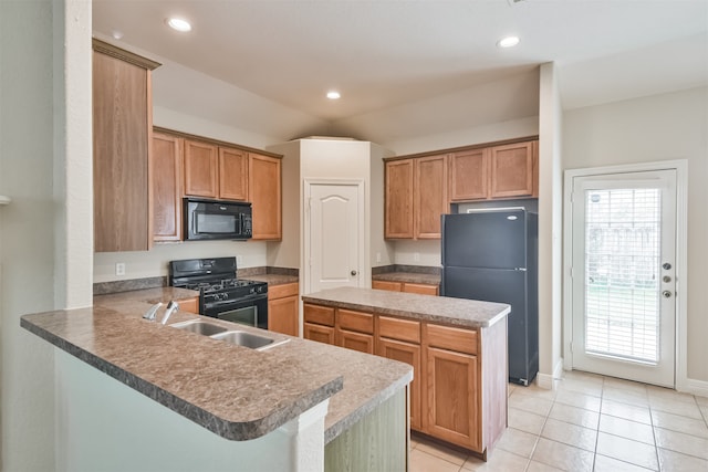 kitchen featuring kitchen peninsula, light tile patterned flooring, sink, and black appliances