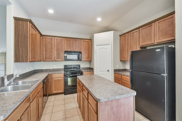 kitchen featuring sink, light tile patterned floors, a center island, and black appliances