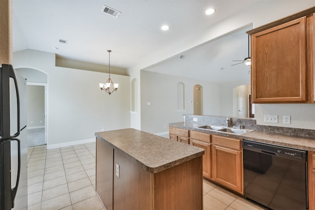 kitchen with ceiling fan with notable chandelier, dishwasher, light tile patterned floors, sink, and a kitchen island