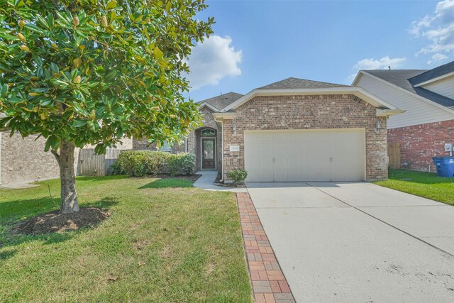 view of front facade featuring a garage and a front yard