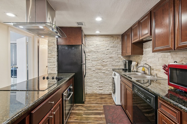 kitchen featuring dark stone counters, sink, dark hardwood / wood-style flooring, black appliances, and island range hood