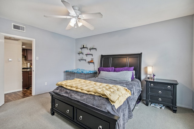 bedroom with light colored carpet and ceiling fan