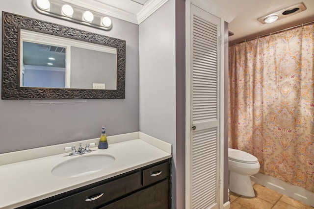 bathroom with tile patterned flooring, toilet, vanity, and ornamental molding