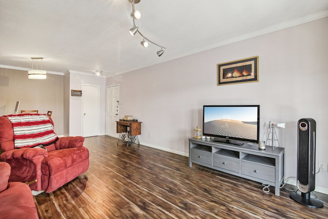 living room with dark hardwood / wood-style floors, rail lighting, and ornamental molding