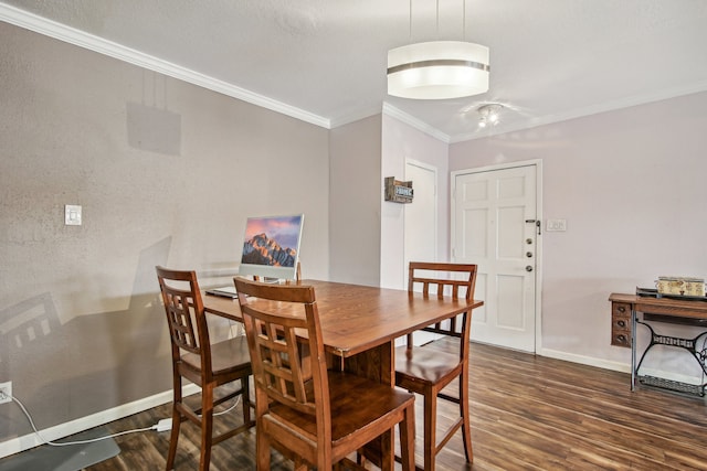 dining room with wood-type flooring and ornamental molding