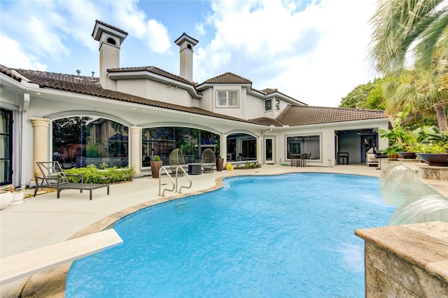 view of pool featuring a patio and pool water feature