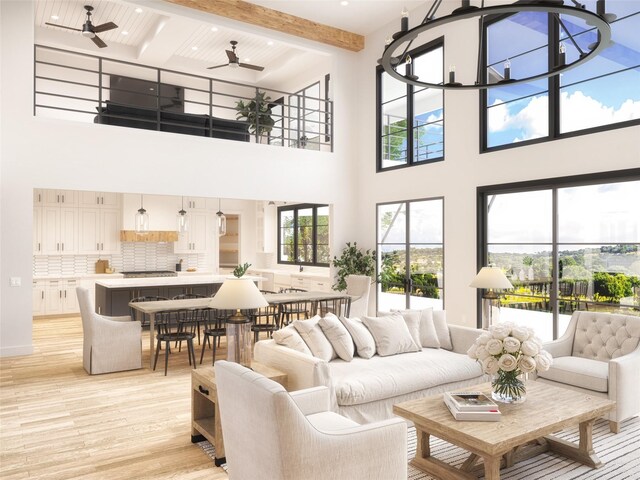 living room featuring a high ceiling, light hardwood / wood-style floors, and beam ceiling