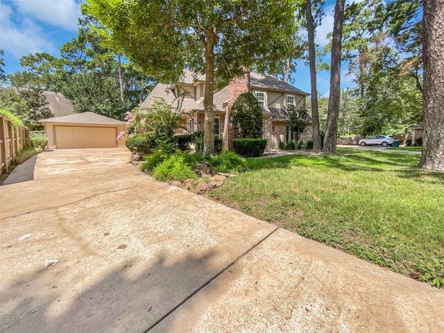 15215 Benfer Rd, Houston, TX 77069 - view of front of property with a garage and a front yard