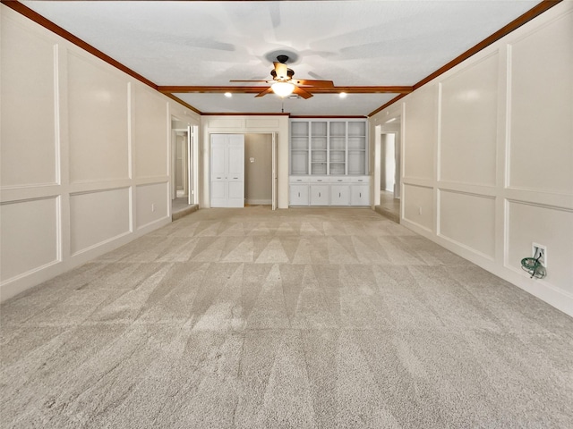 15215 Benfer Rd, Houston, TX 77069 - unfurnished living room featuring ceiling fan, ornamental molding, and light carpet