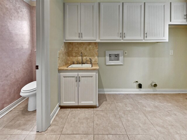15215 Benfer Rd, Houston, TX 77069 - laundry area featuring light tile patterned flooring, gas dryer hookup, hookup for a washing machine, and sink