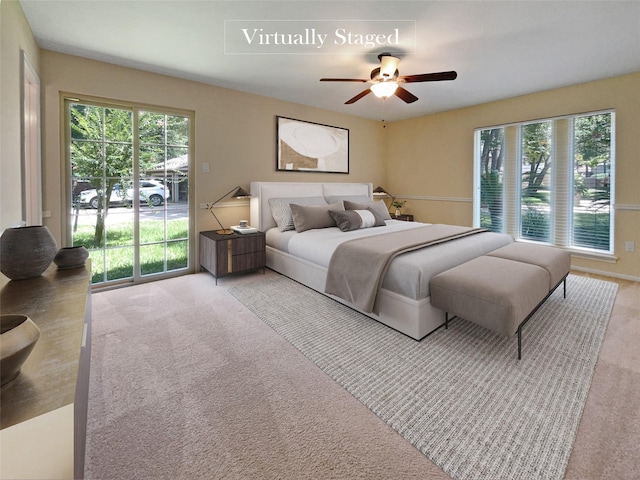 15215 Benfer Rd, Houston, TX 77069 - bedroom with ceiling fan, access to exterior, light carpet, and multiple windows