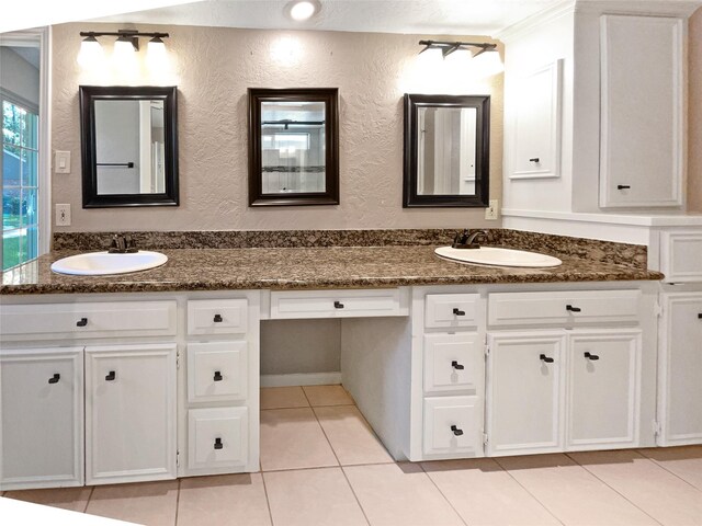 bathroom featuring tile patterned floors and dual bowl vanity