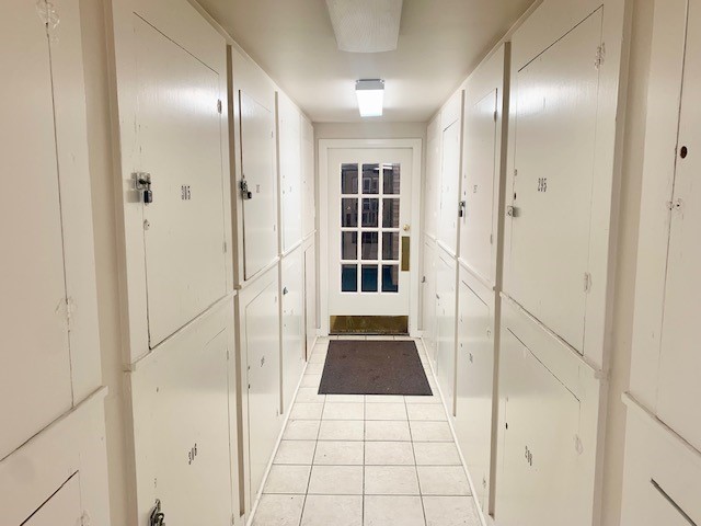 hallway with light tile patterned floors