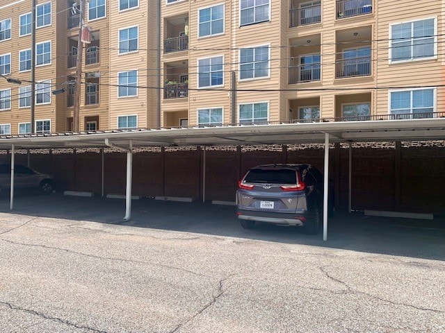 view of parking featuring a carport