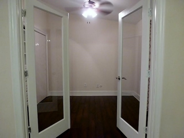 corridor featuring dark wood-type flooring