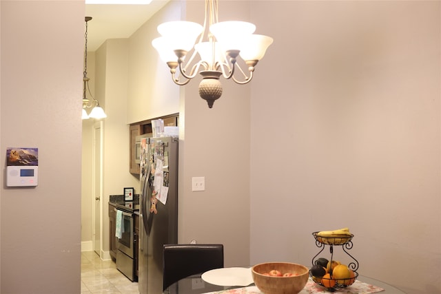 tiled dining space featuring an inviting chandelier