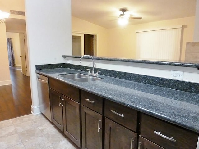 kitchen with ceiling fan, sink, light hardwood / wood-style flooring, stainless steel dishwasher, and dark stone counters