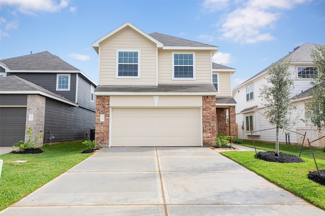 view of front of property with a garage and a front yard