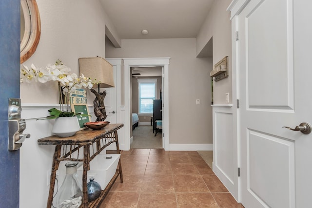 hallway featuring light tile patterned flooring