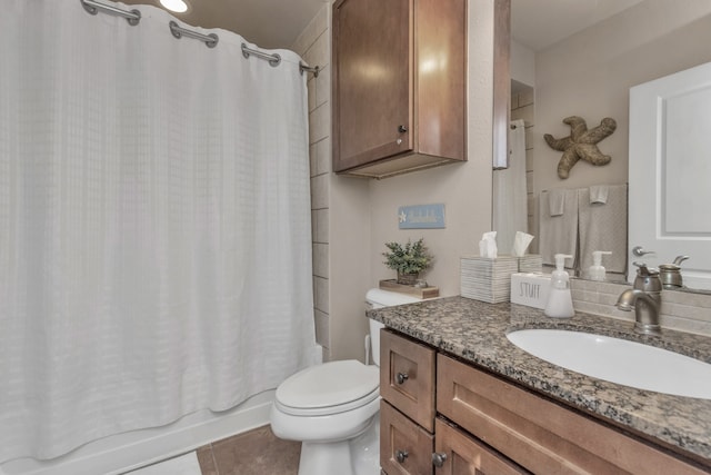 full bathroom with vanity, shower / tub combo, tile patterned flooring, and toilet