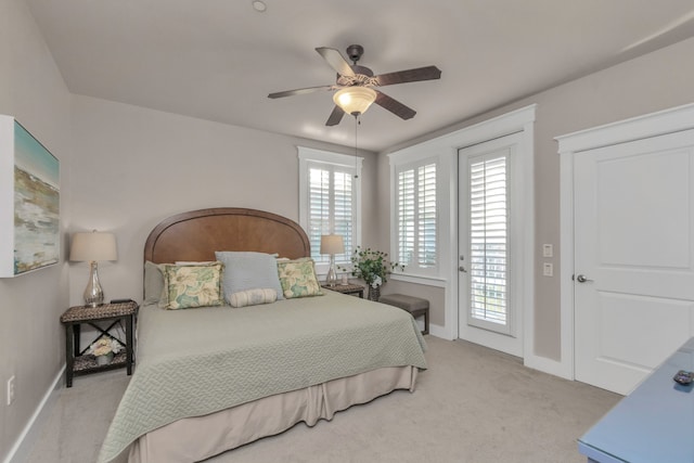 bedroom featuring light carpet, ceiling fan, and access to exterior