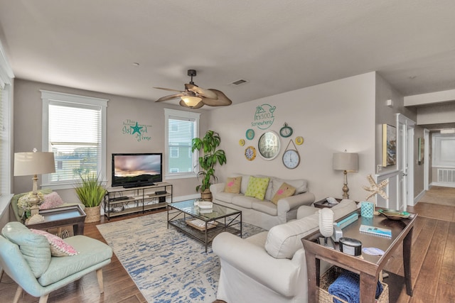 living room featuring ceiling fan and hardwood / wood-style floors