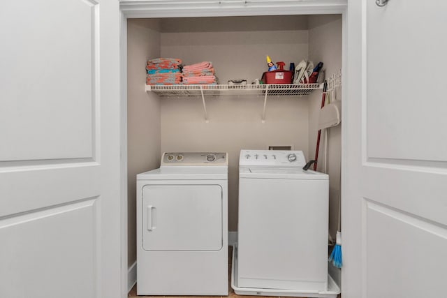 laundry area with washing machine and clothes dryer