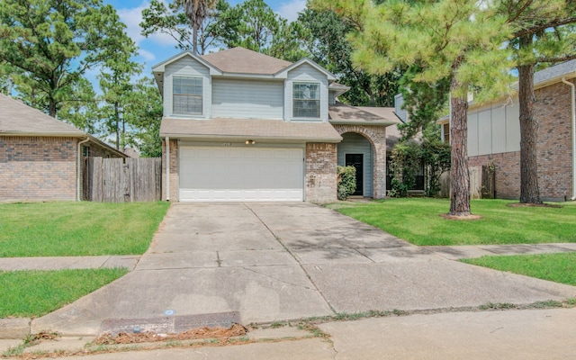 view of front facade with a front yard and a garage