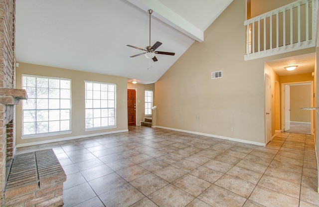 unfurnished living room featuring high vaulted ceiling, ceiling fan, light tile patterned flooring, and a brick fireplace