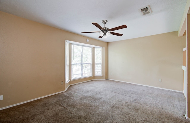 carpeted empty room with ceiling fan