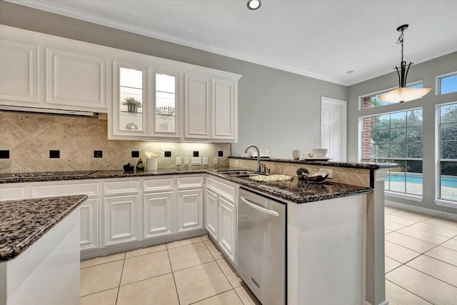 kitchen featuring white cabinetry, stainless steel dishwasher, black electric cooktop, and hanging light fixtures