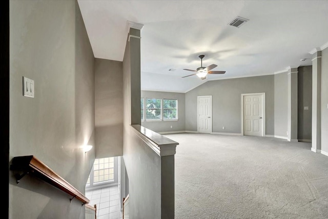 interior space featuring ceiling fan, lofted ceiling, and ornate columns