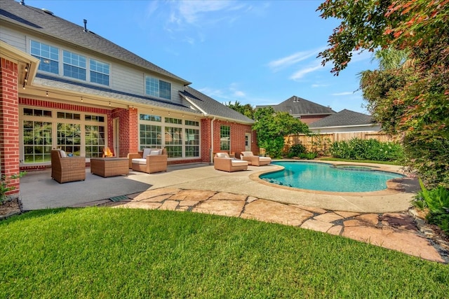 view of pool featuring a yard, an outdoor hangout area, and a patio area