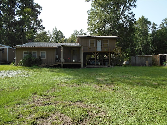 back of house with a yard