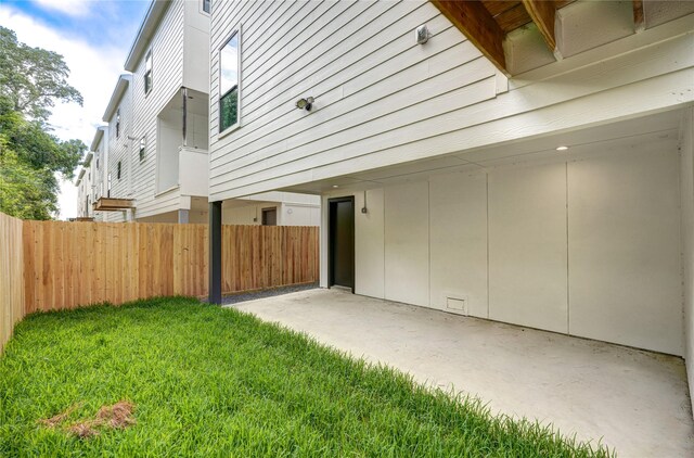 exterior space with a patio and a yard