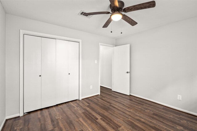 unfurnished bedroom with ceiling fan, hardwood / wood-style floors, and a closet