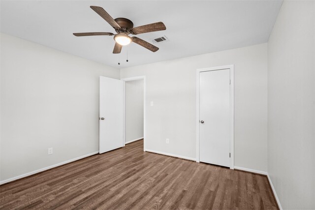 unfurnished bedroom featuring wood-type flooring and ceiling fan