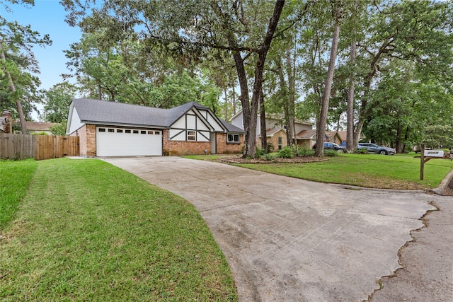 view of front of home with a garage and a front lawn