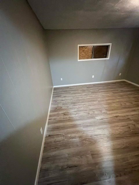 empty room featuring hardwood / wood-style flooring