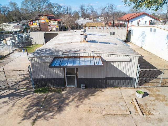 rear view of property with an outdoor structure