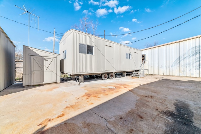 exterior space with a storage shed