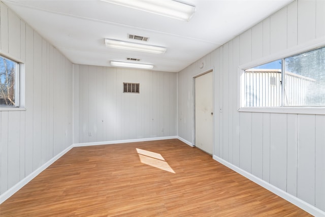 unfurnished room with light wood-type flooring