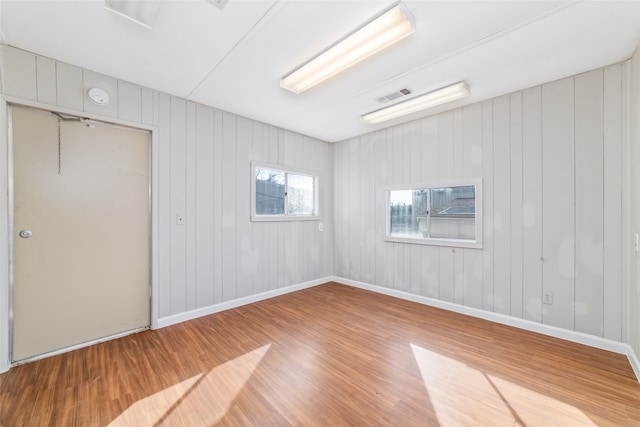 spare room featuring hardwood / wood-style floors