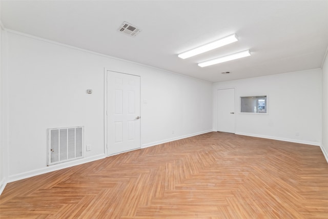 unfurnished room with light parquet floors