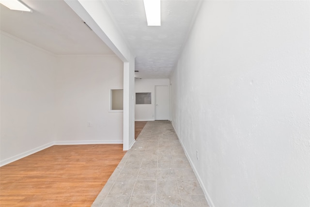 corridor with light tile patterned floors